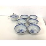 A set of six rice pattern Chinese bowls, together with teapot (11cm x 16cm x 10cm)