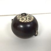 An early 20thc betel nut footed hinged box of circular form with bone inlaid top (9cm)