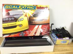 A Scalextric toy racing car set, includes tracks, cars, controllers, in original box along with