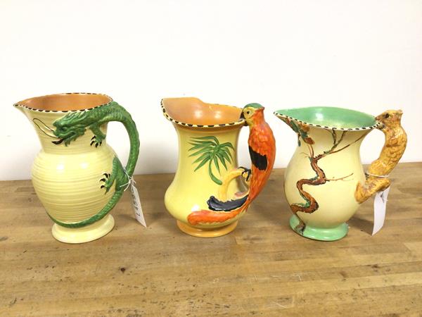 A group of three 1920s/30s Burleigh ware water jugs, all with novelty handles, including a Dragon, a