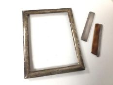 A Birmingham silver photograph frame (internal: 17cm x 13cm) and a Birmingham silver comb with