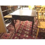 A reproduction mahogany Georgian style tea table, with raised moulded edge above a single drawer, on