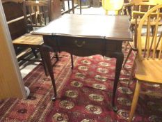 A reproduction mahogany Georgian style tea table, with raised moulded edge above a single drawer, on