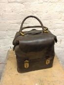 A vintage doctor's bag with two handles and zipped closure, hinged opening, fitted to interior,