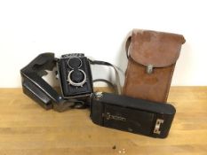 A Lubitel 2 camera with original travelling case and a Kodak A116 camera with original leather