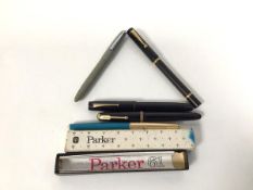 A group of three Parker pens including The Parker 61, with original box, a Platignum, a Delarue