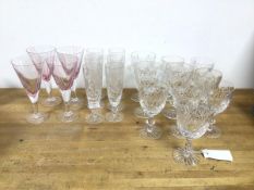 A collection of stemware including six cut glass champagne flutes (17cm), with matching wine