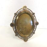 A late 19thc enamelled gilt and silvered brass photograph frame, oval, probably French, with pierced