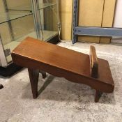 A 1920s/30s mahogany shoe shine ledge, with raised foot rest and moulded aprons (35cm x 63cm x