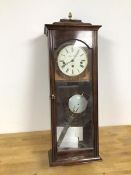 A modern mahogany wall clock, the sarcophagus top with acorn finial, the dial marked James