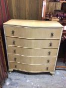 A 1950s/60s chest of drawers with serpentine front, fitted five long drawers, on cabriole