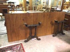 A large ship's desk, with rectangular teak top above two frieze drawers, on cast iron supports