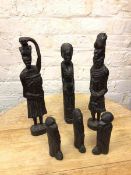 Carved Three Wise Monkeys and three carved African figures (tallest: 43cm)