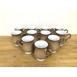 A set of eleven Denby mugs of tulip form with handles to side and cappuccino coloured ground (