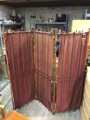 A late 19thc/early 20thc bamboo three fold screen with striped fabric panels (168cm x 173cm -