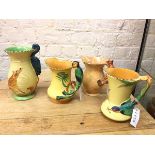 A group of three Burleighware majolica jugs, all with animal handles and a Burleighware vase with
