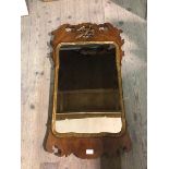 A reproduction Georgian style mirror with moulded frame and ho ho bird (92cm x 50cm)
