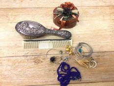 An Edwardian Chester silver backed hairbrush (22cm) and matching comb, with a small quantity of
