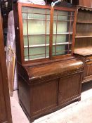 A late 19thc mahogany bureau bookcase, the bookcase with glazed doors and three shelves above a