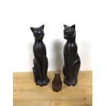 A pair of ceramic Art Deco style cats (each: 33cm) and a carved wooden cat (11cm) (3)