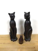 A pair of ceramic Art Deco style cats (each: 33cm) and a carved wooden cat (11cm) (3)