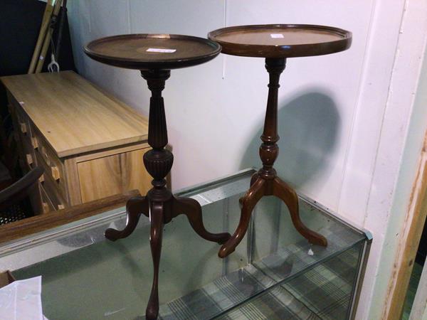 Two reproduction wine tables, each with a raised edge above a turned stem on tripod base (larger: