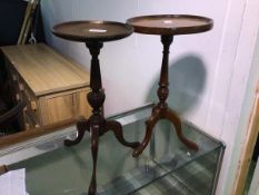 Two reproduction wine tables, each with a raised edge above a turned stem on tripod base (larger: