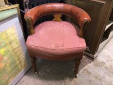 A Victorian tub library chair, the curved back with studded leather above moulded splat, with