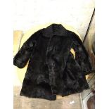 A fur coat (37cm across shoulders)
