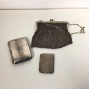 A 1920s Birmingham silver cigarette case (9cm x 6cm) and a Birmingham silver matchbook case with