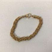 A 9ct gold fancy oval and lozenge link chain bracelet with lobster claw fastening, stamped 375 (