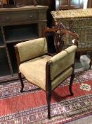 A late Victorian mahogany library chair with moulded top rail above a pierced splat, upholstered