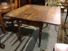 A 19thc mahogany pembroke table, the rectangular top with rounded edges, the drop leaves on pull out