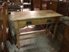 A Victorian pine kitchen table, the rectangular top above two frieze drawers, on turned supports