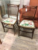 A pair of Edwardian side chairs, the pierced top rail with fan inlay to corners above a banister