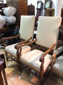 An pair of Edwardian open armchairs, in 17thc style, each square upholstered back within downswept