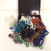 A quantity of costume jewellery including beads, brooches, bangles etc., including a coral necklace,