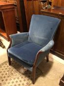 A Parker Knoll low armchair with scroll arms and blue upholstered back, arms and seat cushion, on
