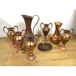 A collection of copper including two ewers (larger: 23cm x 15cm), with brass base, five vases with