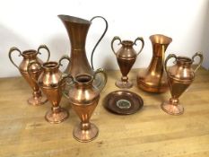 A collection of copper including two ewers (larger: 23cm x 15cm), with brass base, five vases with