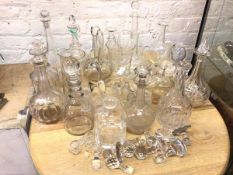 A large collection of glassware including decanters with stoppers (tallest: 32cm), claret jugs,