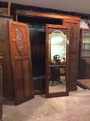 A late Victorian walnut wardrobe, the moulded cornice with plain frieze above three doors, the