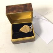 An 18ct gold signet ring with initials to panel (T) (7.85g)