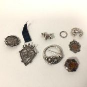 A collection of pins, all marked silver, including a penannular marked Iona (8)