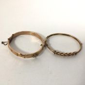 An Edwardian gold bangle (d.6cm) and another 9ct gold bangle (16g)