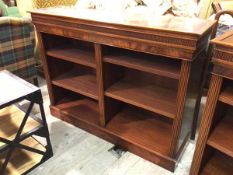 A reproduction Georgian style open bookcase, the rectangular top above a reeded frieze, adjustable