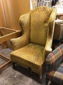 An Edwardian wing back armchair in a damask upholstery (a/f) (123cm x 93cm x 73cm)