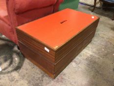 A 1970s teak toy box with painted top and pierced handle, on plinth base (41cm x 94cm x 54cm)