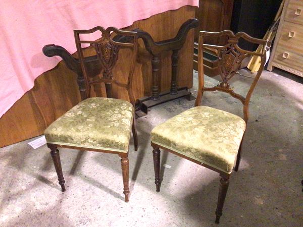 A pair of late 19thc rosewood side chairs, each with an undulating top rail, with pierced and inlaid