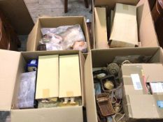 Seven boxes of doll parts and accessories including heads, limbs, hair, baskets (a lot)